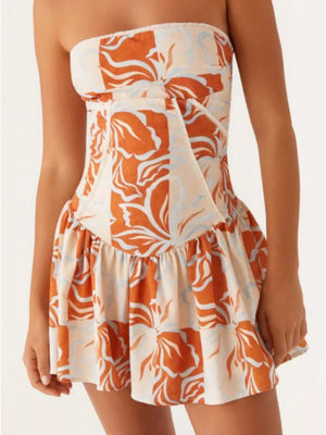 Ruffled tube dress in floral print with a cinched waist and tiered skirt.