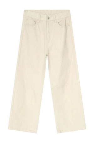 Oversized beige denim jeans with a sculpted leg and neutral wash.