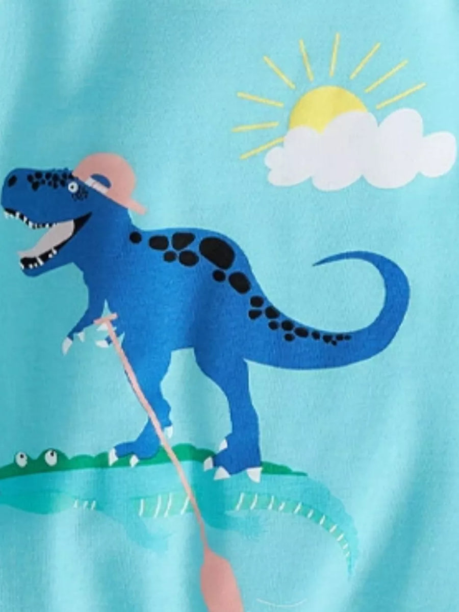 Light blue t-shirt with a graphic of a blue dinosaur wearing a pink hat and fishing