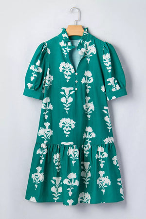 Green floral mini dress with puff sleeves, ruffled collar, and tiered hem.