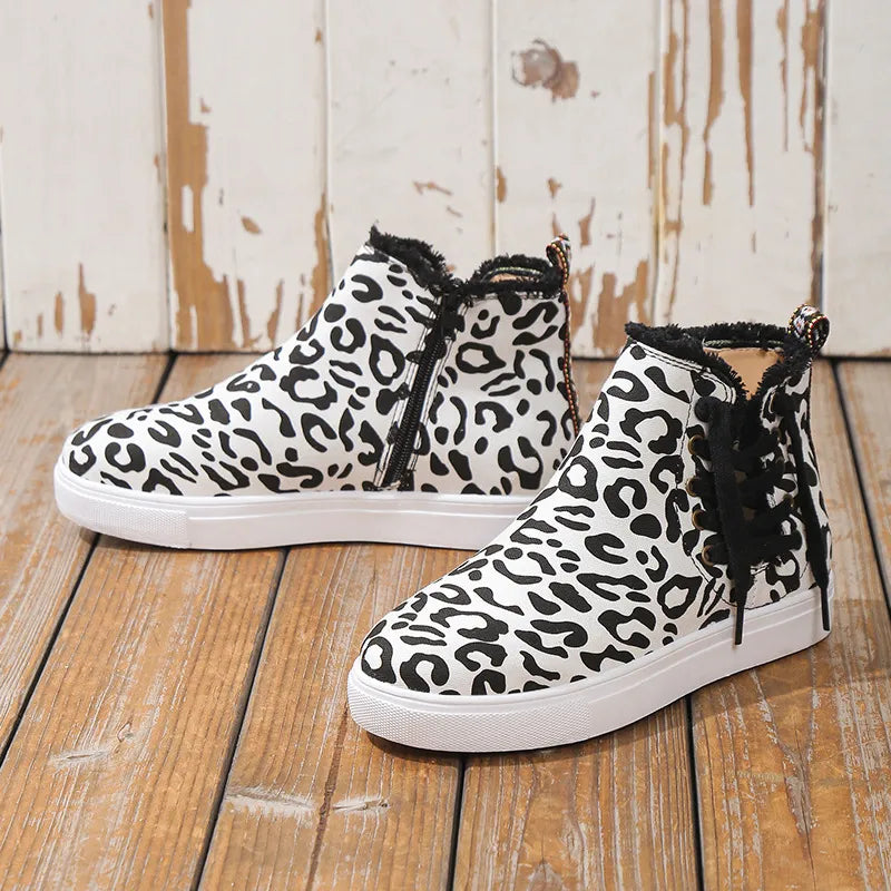 Canvas leopard print zip-up sneaker booties with black laces and faux fur trim.