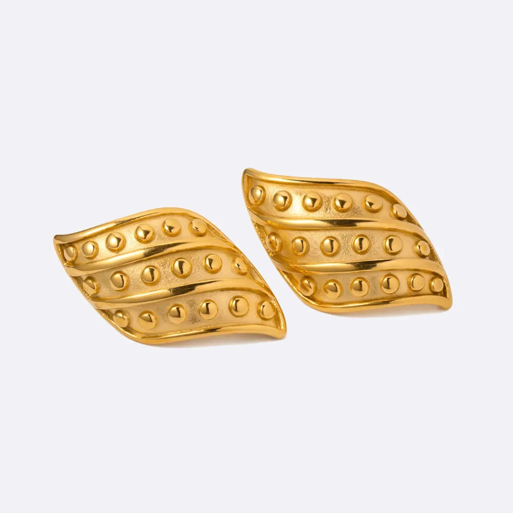 Sculpted gold leaf stud earrings with raised dot pattern, 18K gold-plated