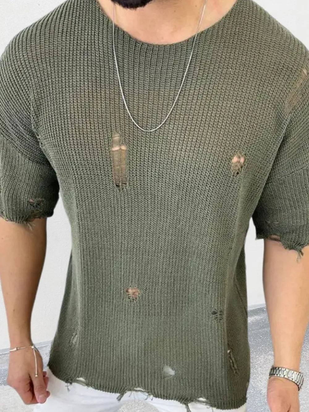 Army green open-knit destroyed crewneck tee with short sleeves and distressed details.