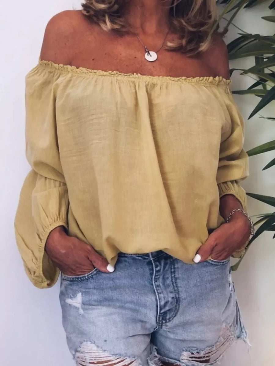 Yellow off-the-shoulder maternity shirt with gathered neckline and frill detail.