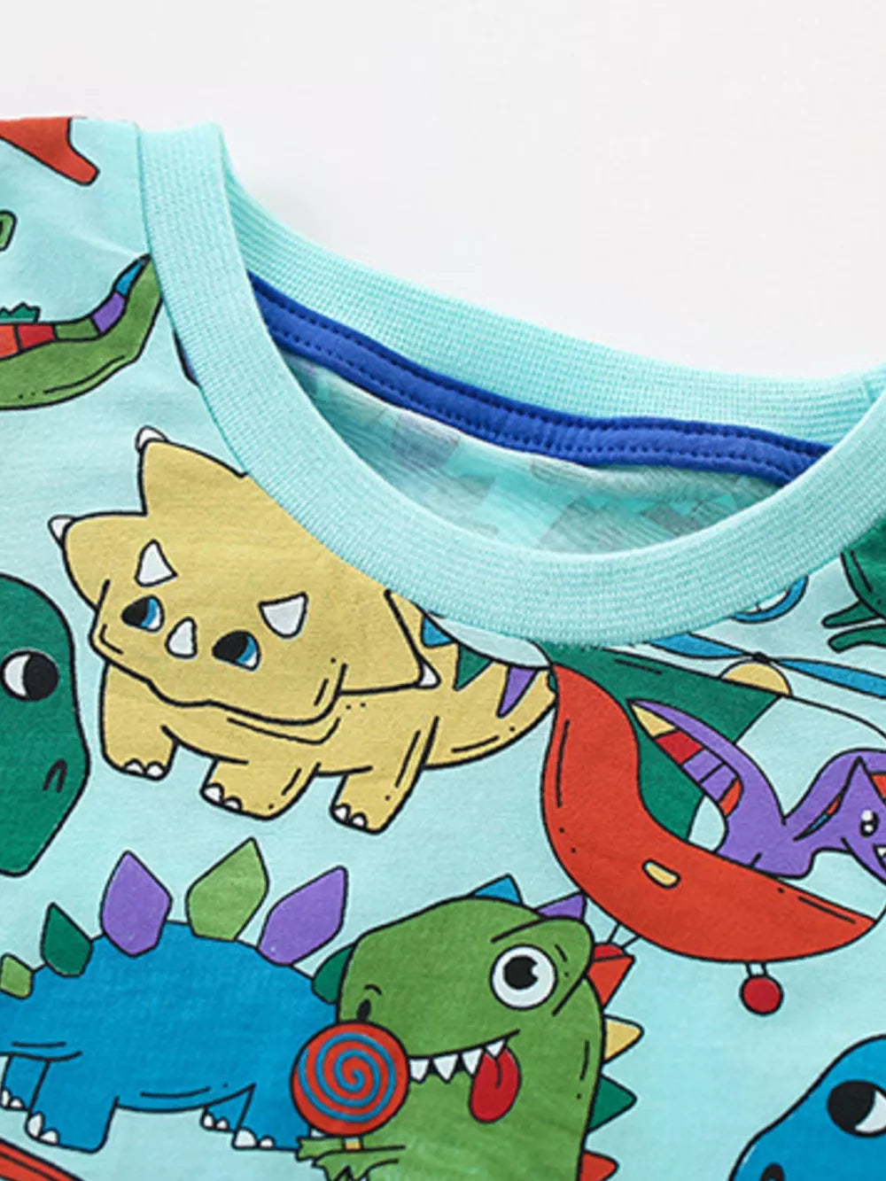 Boys' cotton t-shirt with a fun cartoon dinosaur print and light blue crew neck.