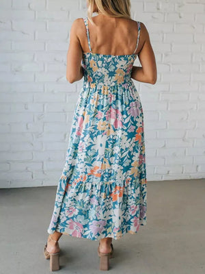 Maxi dress with spaghetti straps, smocked bodice, and floral print.