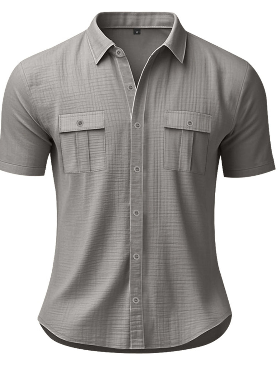 Grey short sleeve button-down shirt with two chest pockets and subtle plaid texture.