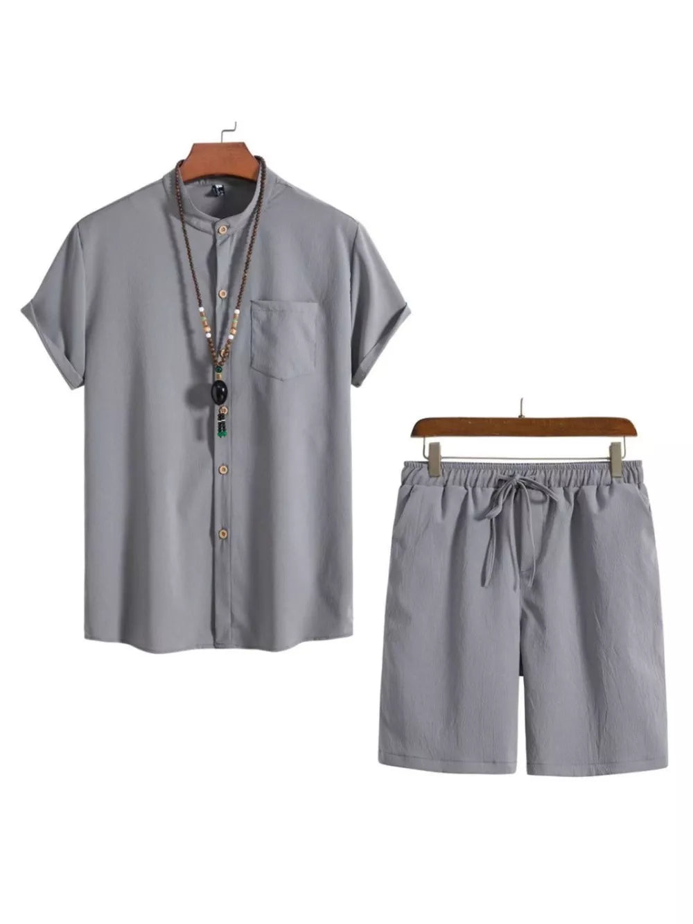 Grey buttoned short-sleeve shirt with mandarin collar and drawstring shorts.