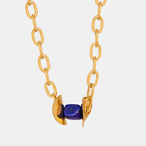 18K gold-plated necklace with dark blue geometric lapis lazuli beads and gold links.