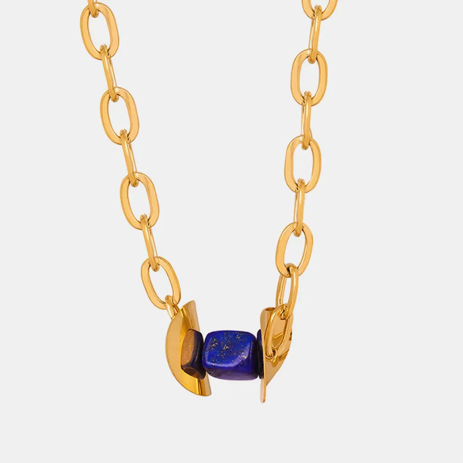 18K gold-plated necklace with dark blue geometric lapis lazuli beads and gold links.