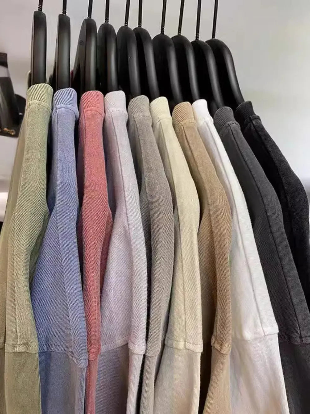 Oversized washed cotton tees in various colors: Moss, Dusty Blue, Sherbet, Light Gray, Beige, Camel, White, Dark Gray, Black.