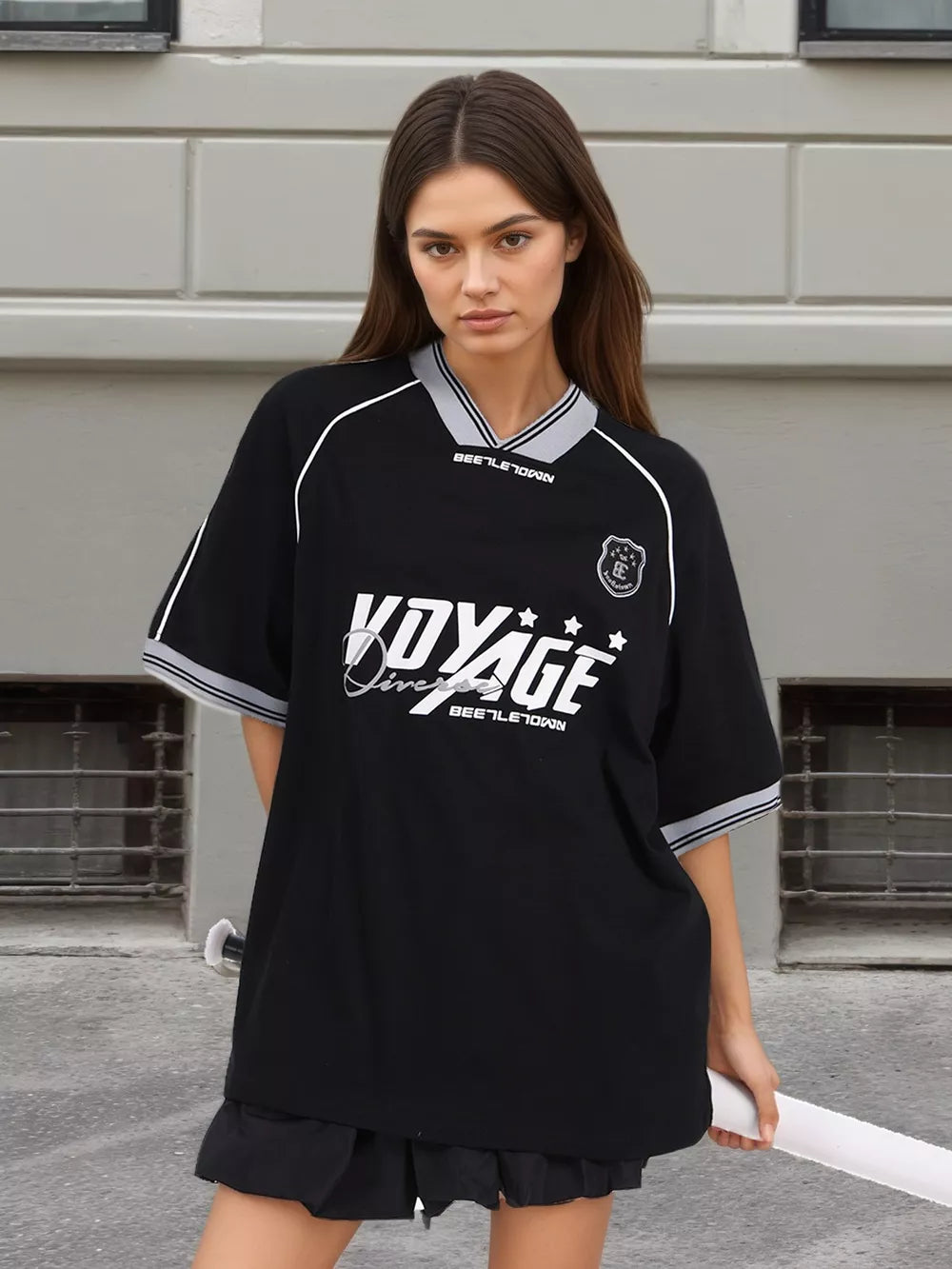 white t-shirt featuring graphic print and graphic