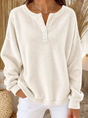 sweatshirt in cream featuring buttoned and relaxed fit