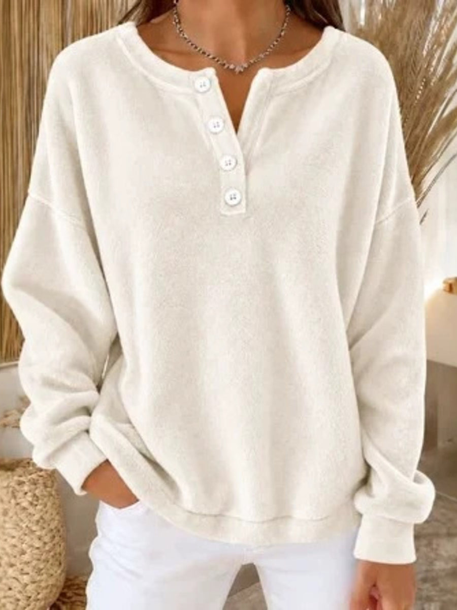 sweatshirt in cream featuring buttoned and relaxed fit