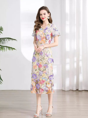 Sheath dress with V-neck, short sleeves, and floral embroidery in pastel colors.
