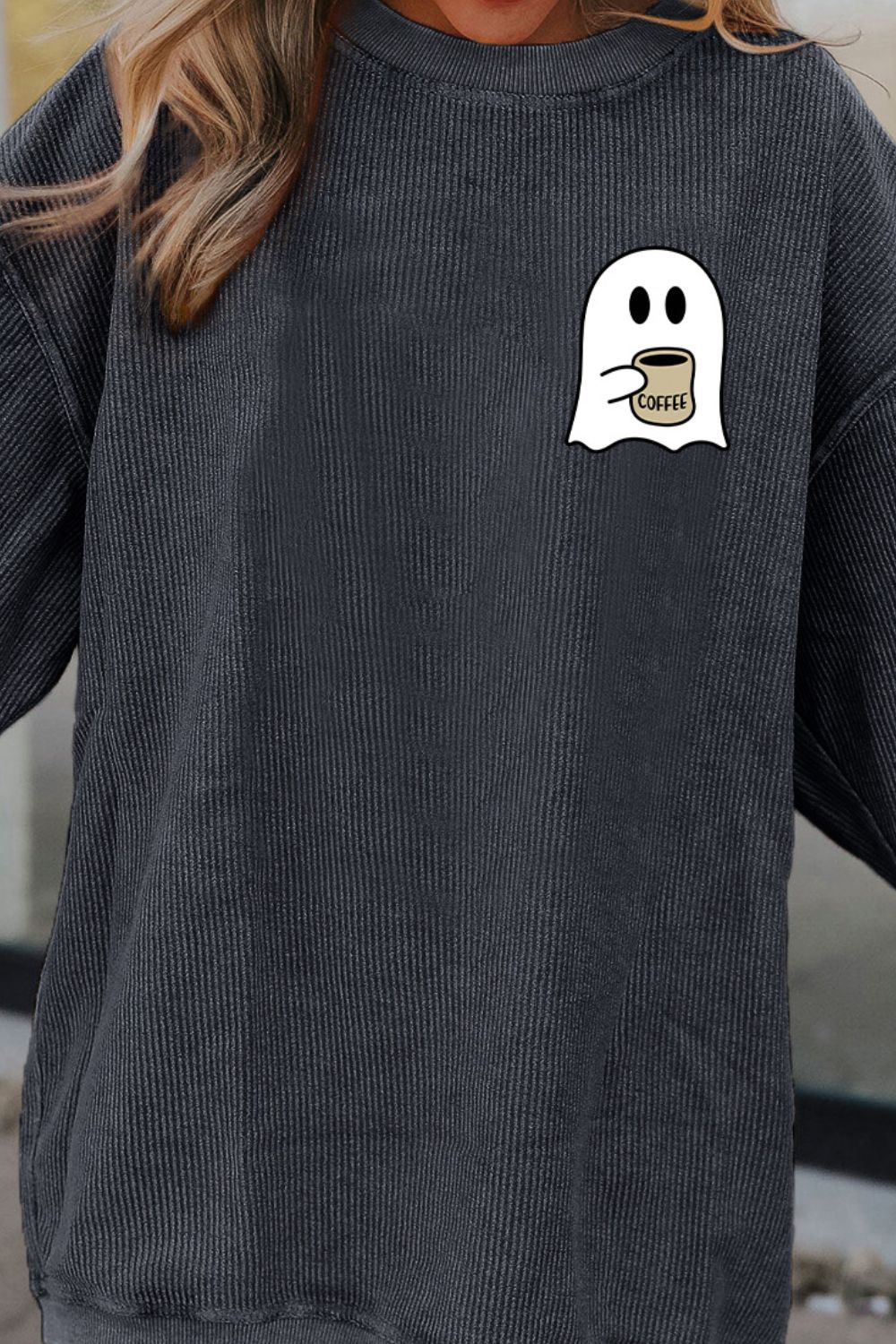 Charcoal corded sweatshirt with a ghost graphic holding a coffee cup.