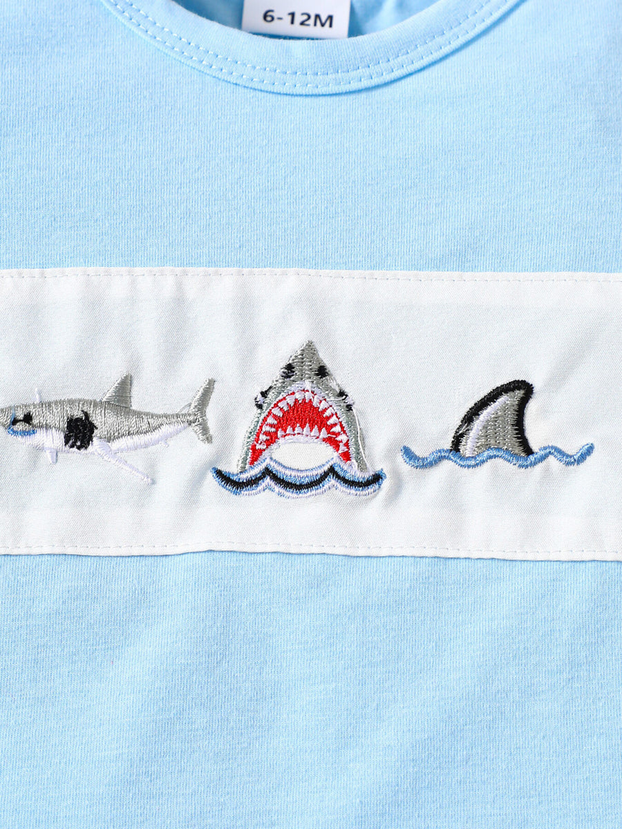 Baby blue cotton t-shirt with embroidered sharks and waves detail