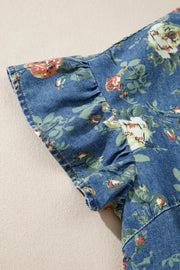 Denim blouse with short ruffled sleeves and a floral print.