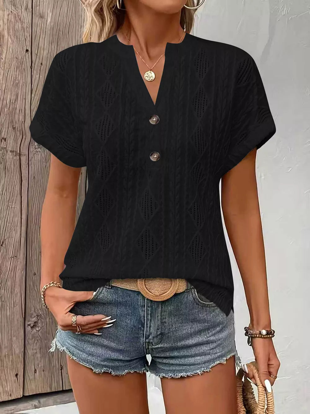 Black diamond pattern short-sleeve t-shirt with button detail and notched neckline.