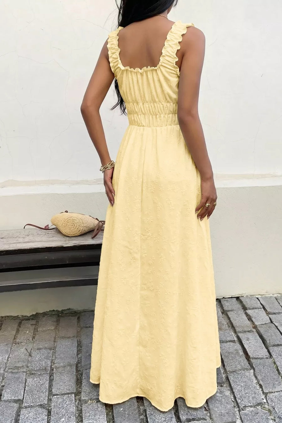 Yellow smocked floral maxi dress with frill straps and a cinched waist.