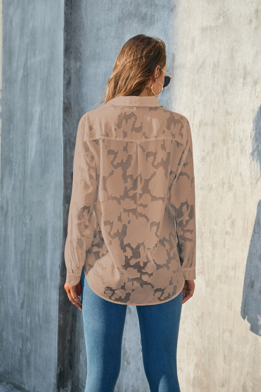 Taupe sheer button-down blouse with floral embroidery and a collared neckline.