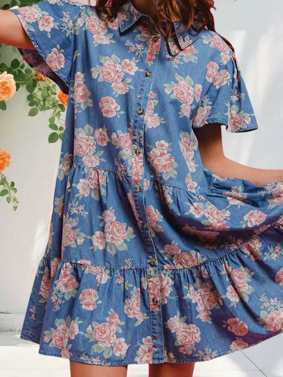 Light blue floral denim mini dress with ruffled tiers and button front.