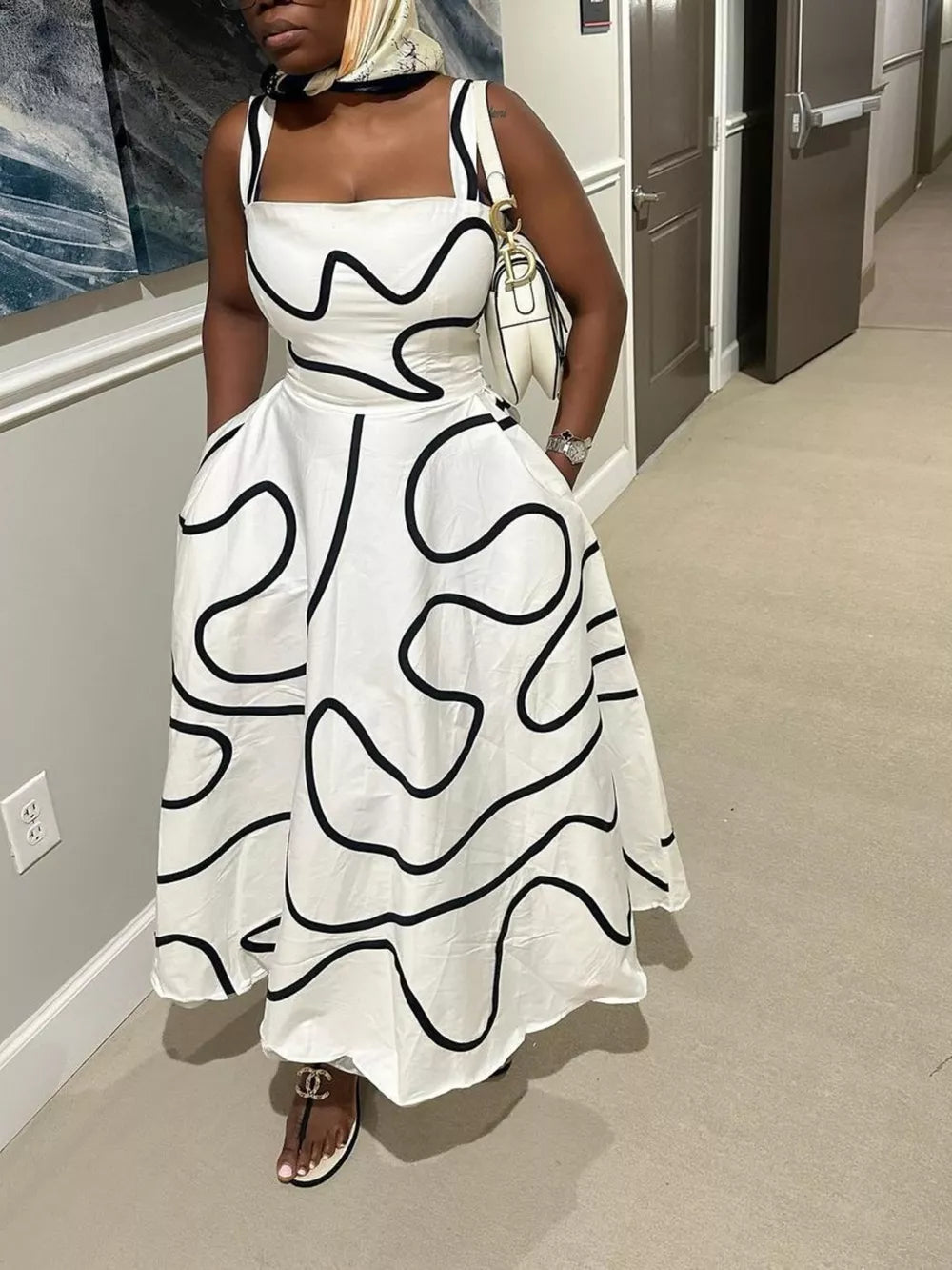 White abstract patterned midi dress with square neck and pockets.