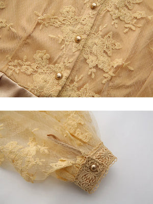 Gold lace-embellished maxi dress with button-down front and lantern sleeves.
