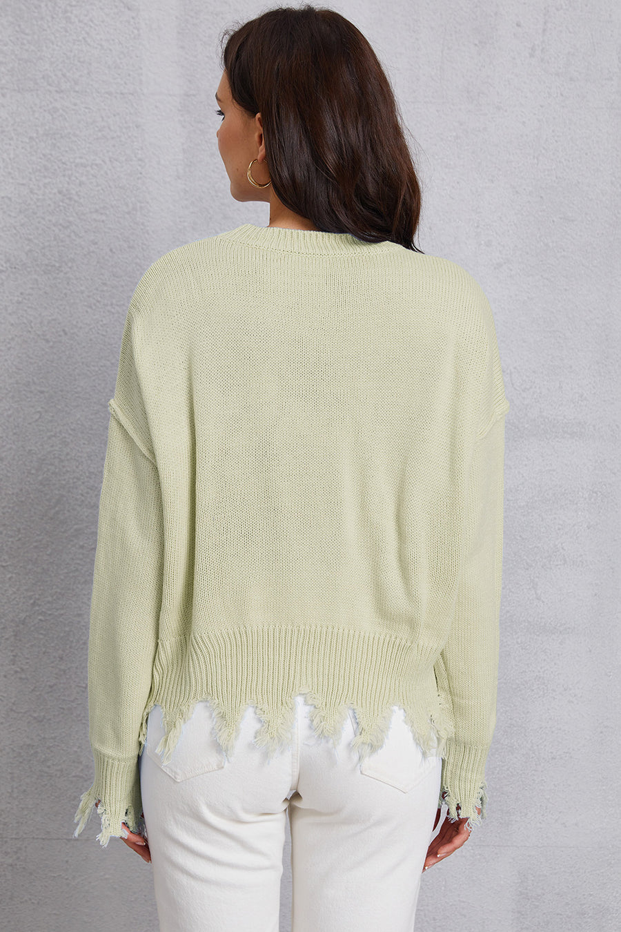 Light Yellow knit sweater with distressed hem and cuffs.