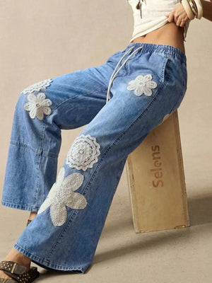 Dark wide-leg jeans with full-length and drawstring