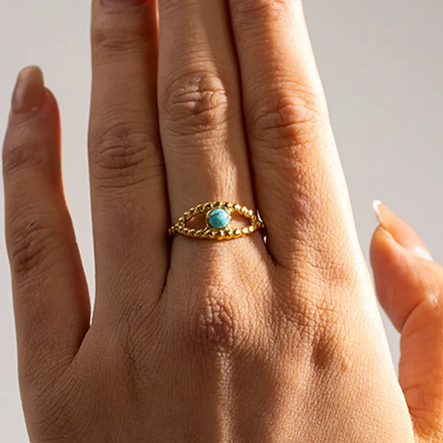 Turquoise, 18K Gold-Plated, Stainless Steel Care instructions: Avoid wearing dur ring in Gold with fitted silhouette