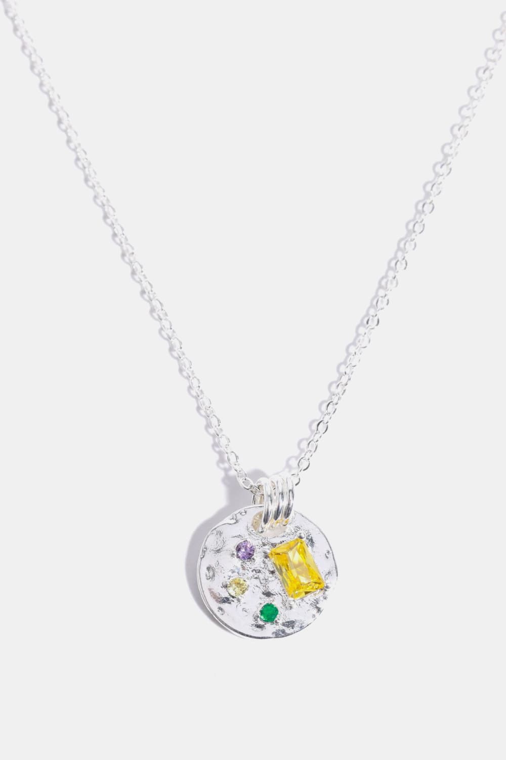 Silver textured disc pendant necklace with colorful gemstone accents