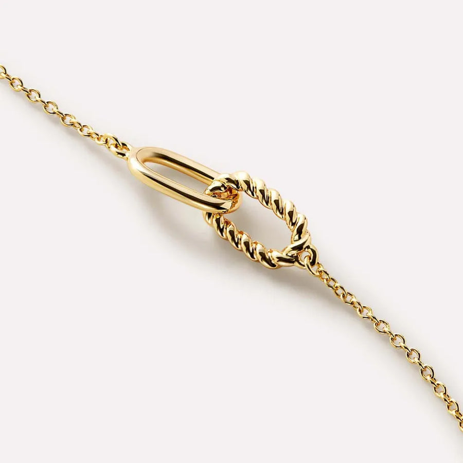 Gold interlocked link necklace with a smooth oval and a twisted oval link.