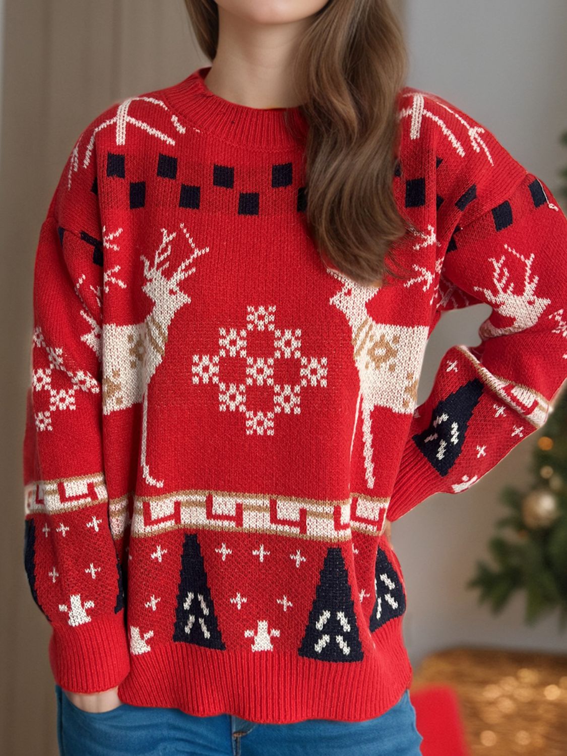 Red acrylic knit sweater with reindeer and snowflake motif, crew neck, long sleeves.