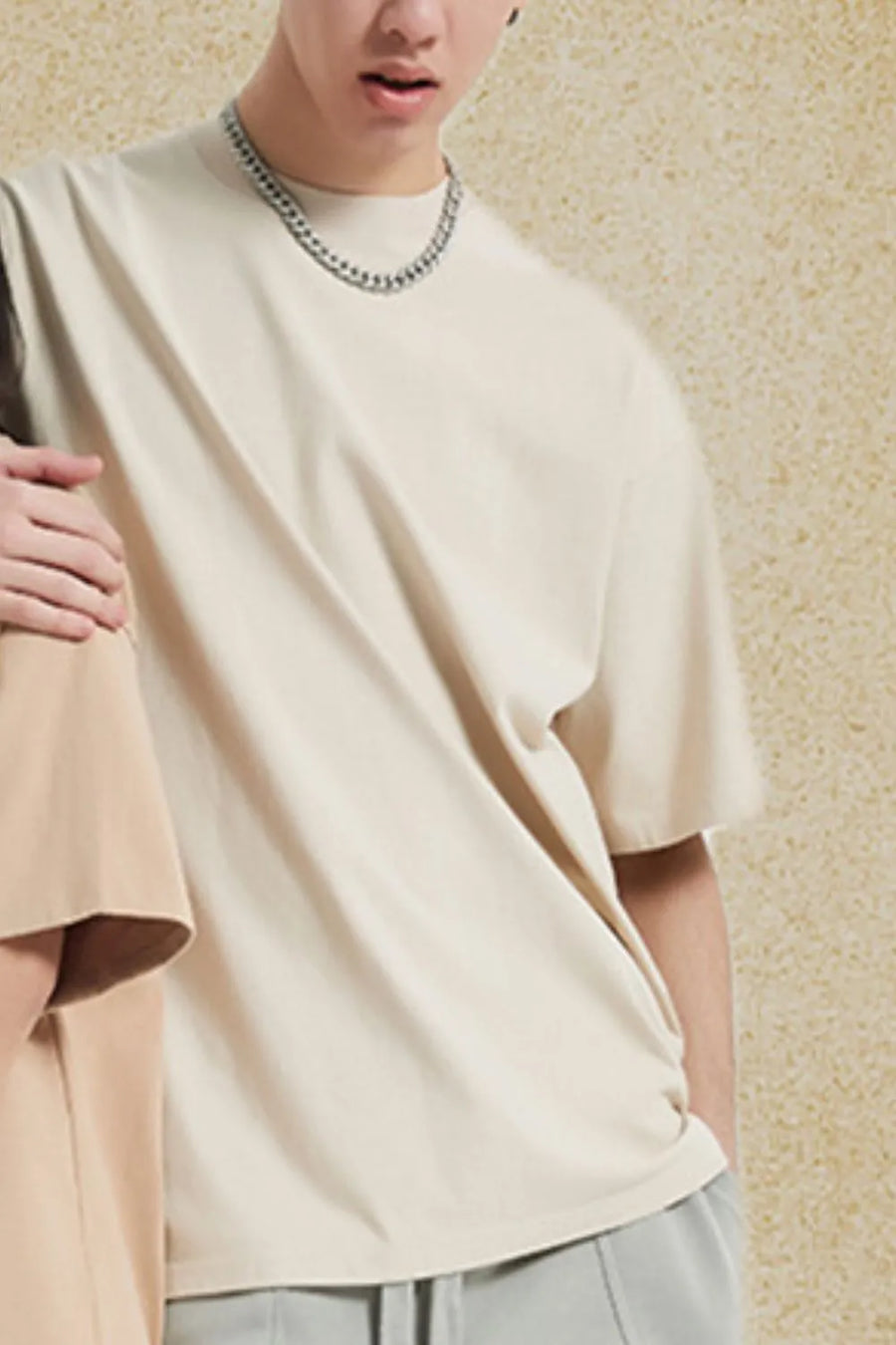 Oversized crewneck tee in beige with relaxed fit and short sleeves.