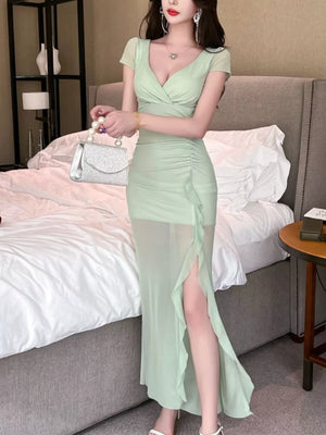 Light green surplice ruffle maxi dress with ruched detail and high slit.