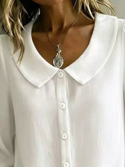100% polyester Care instructions: Machine wash cold button-down shirt in Black with relaxed silhouette