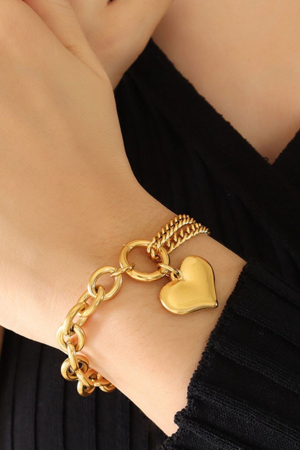 Gold chain bracelet with a heart charm