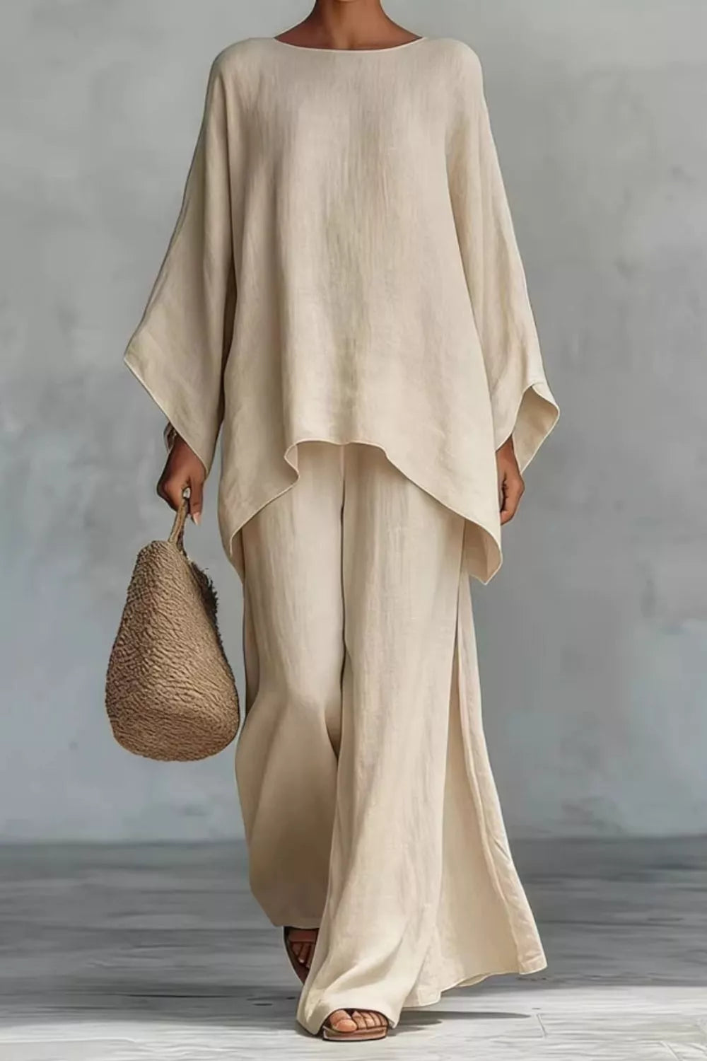 Beige polyester two-piece set with flowing top and wide-leg pants with side slits