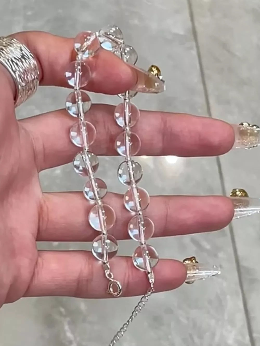 Radiant Crystal Bead Silver Bracelet with adjustable chain and lobster clasp.