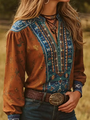 teal blue blouse featuring notched neckline and bohemian print