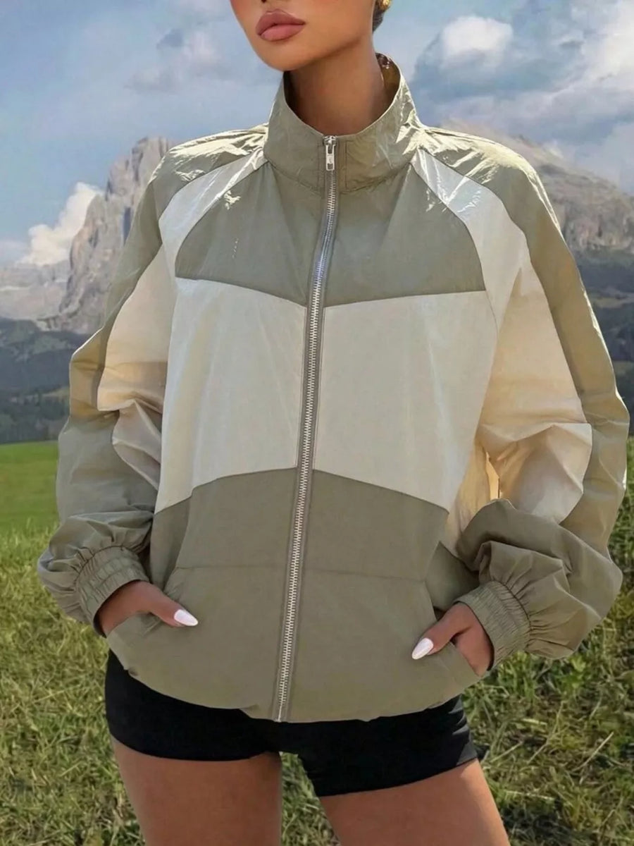 white windbreaker with zipper and long sleeve