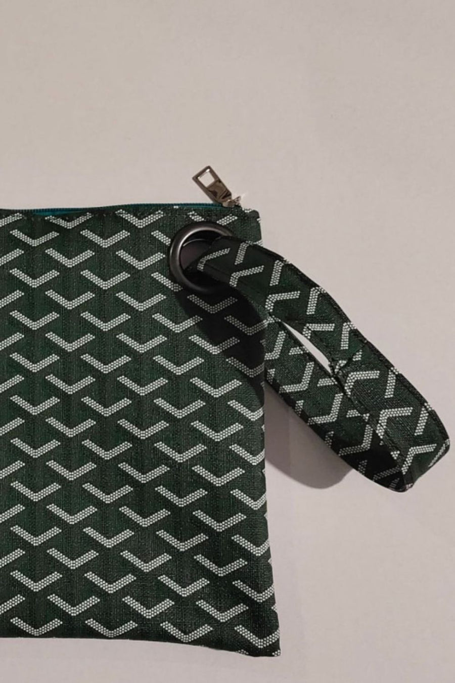 Army green plaid print wristlet clutch with grommet detail and zipper