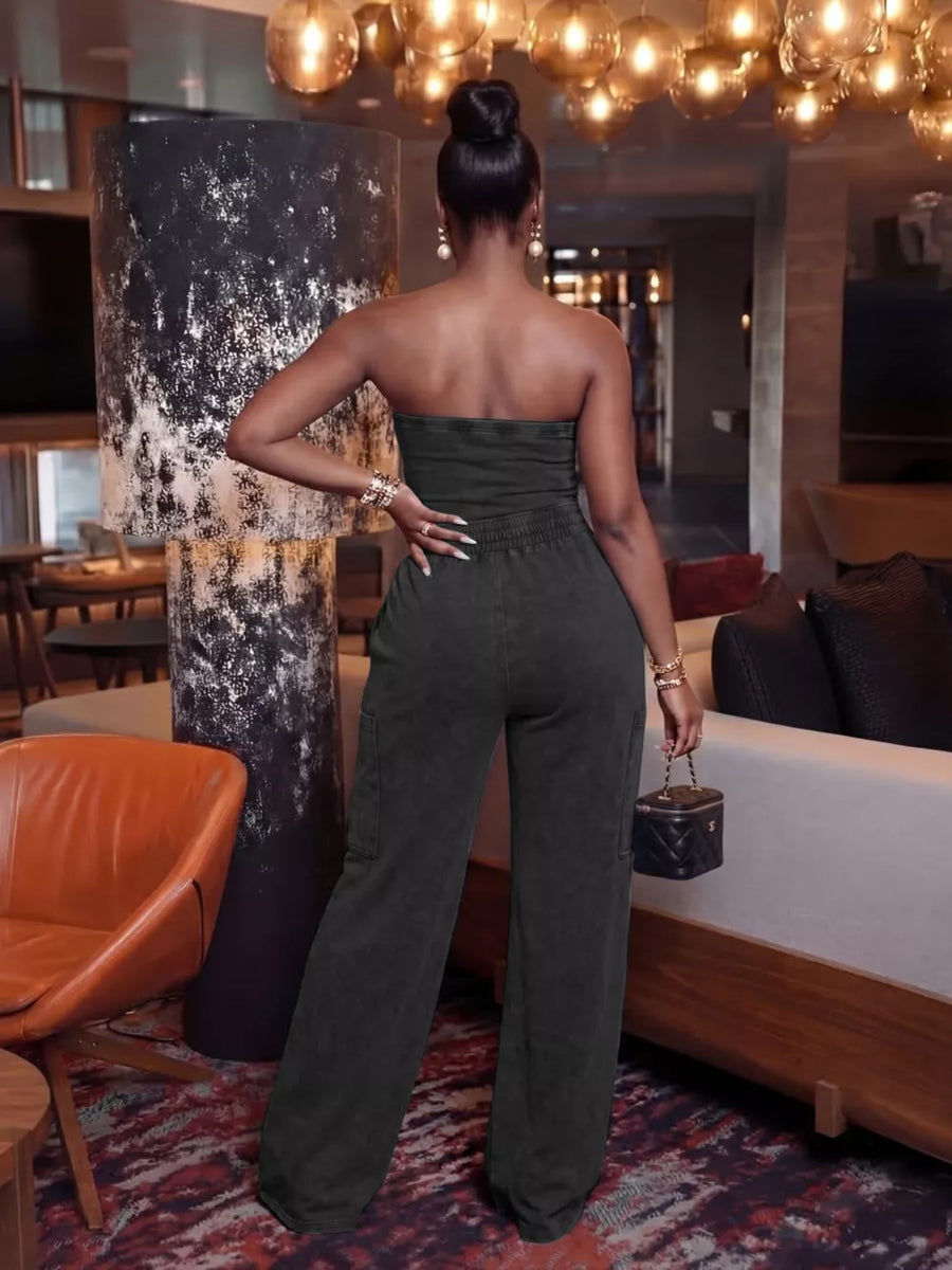 Dark grey strapless jumpsuit with wide legs and cargo pockets
