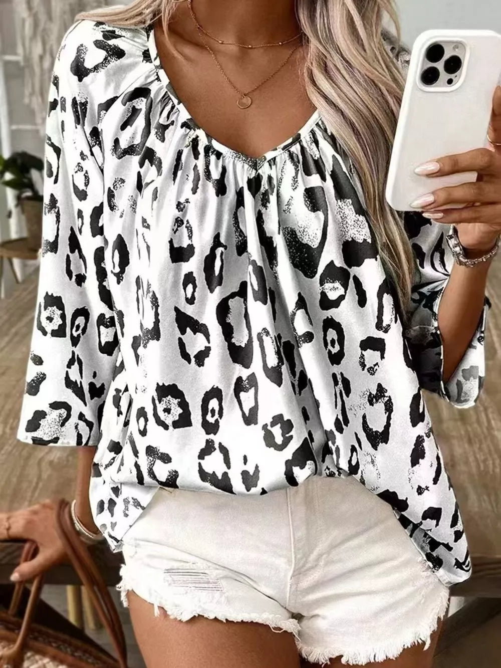 white blouse with leopard-print and v-neck