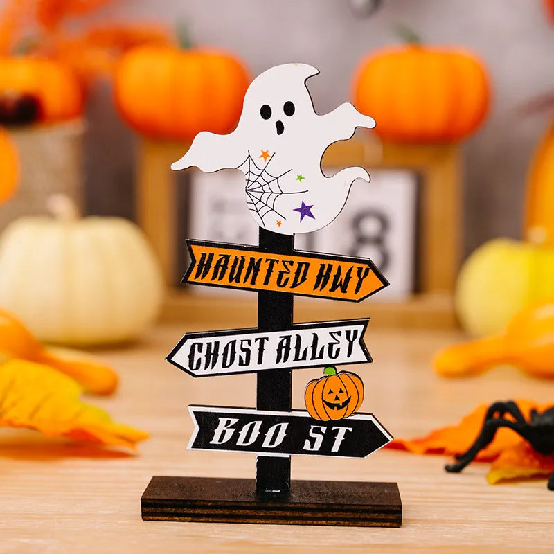 Spooky signpost decor with ghost, Haunted Hwy, Ghost Alley, Boo St signs and pumpkin.