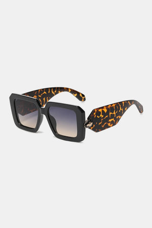 Geometric facet sunglasses with tortoise shell arms and snake embellishment