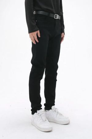 Black slim-fit stretch denim trousers with a black belt.