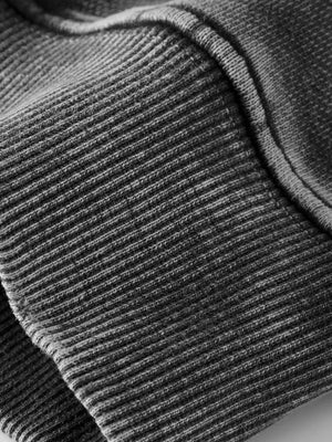 70% cotton, 30% polyester Care instructions: Machine wash cold pullover hoodie in charcoal with oversized silhouette