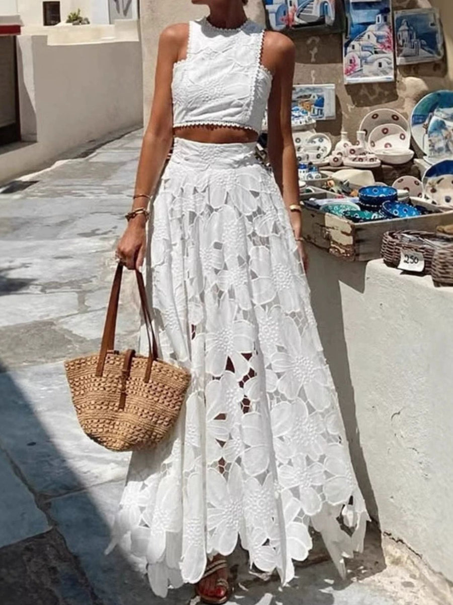 White floral lace crop top and cutout maxi skirt set with scalloped trim.